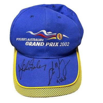 Vintage blue and yellow Formula 1 Grand Prix 2002 cap, hand-signed by unknown celebrities.
