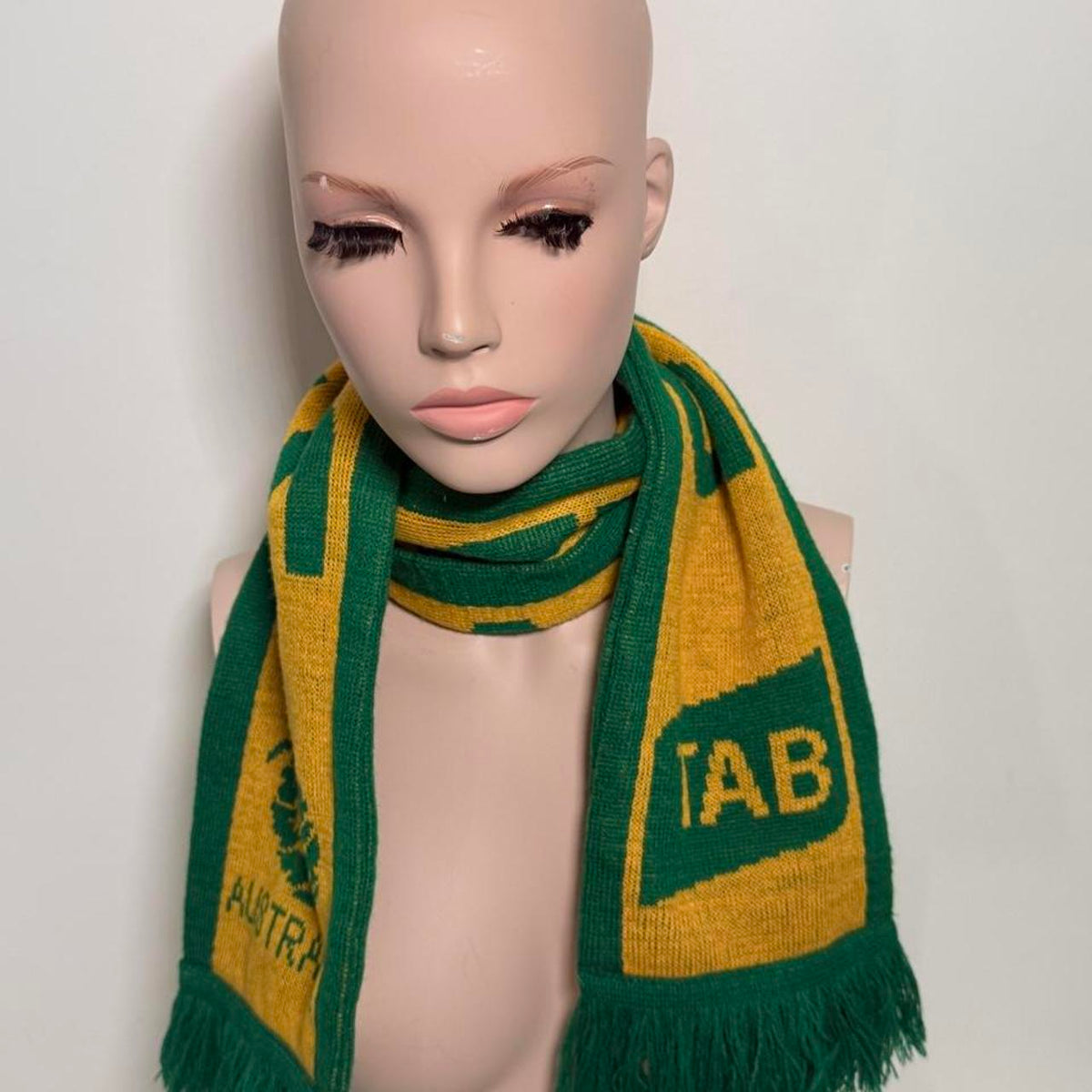 Australia soccer scarf featuring green and yellow stripes, a green tree logo, and the word 'AUSTRALIA'.