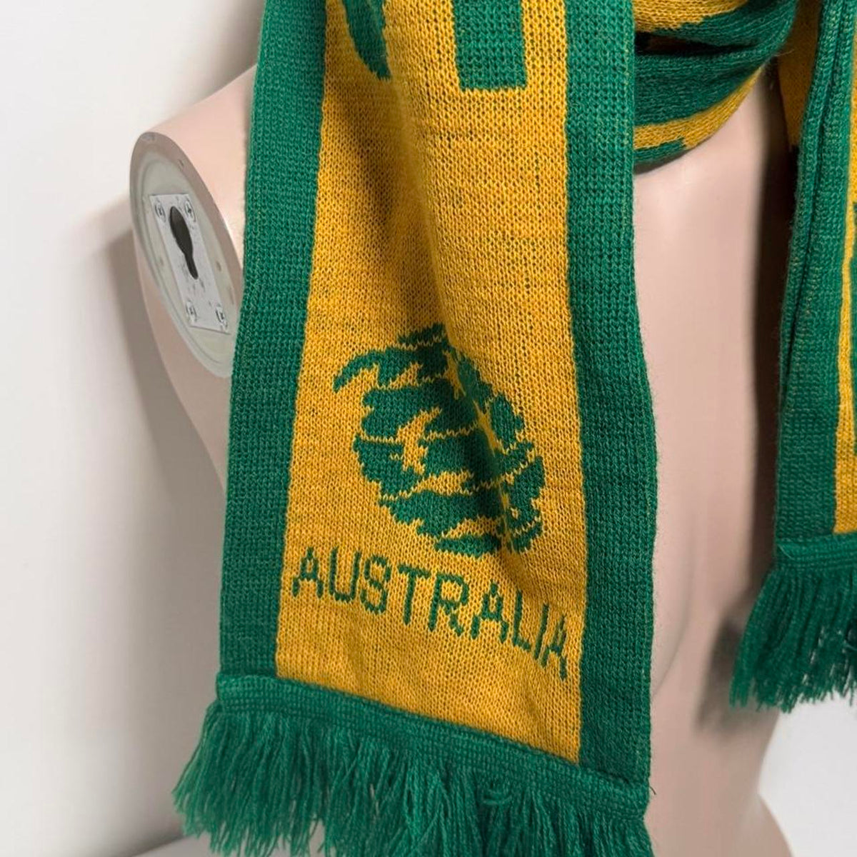 Australia soccer scarf featuring green and yellow stripes, a green tree logo, and the word 'AUSTRALIA'.