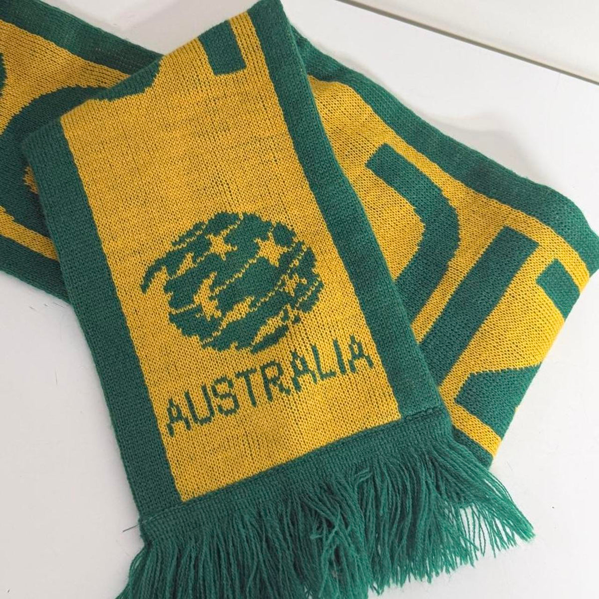 Australia soccer scarf featuring green and yellow stripes, a green tree logo, and the word 'AUSTRALIA'.