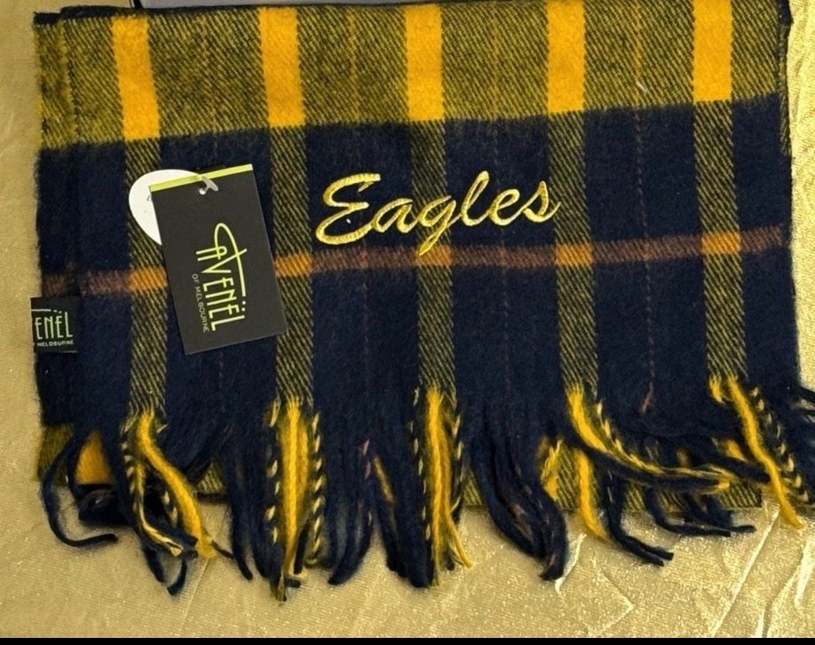 New West Coast Eagles AFL scarf by Avenel, featuring a retro navy, yellow, and brown tartan pattern with fringed ends.