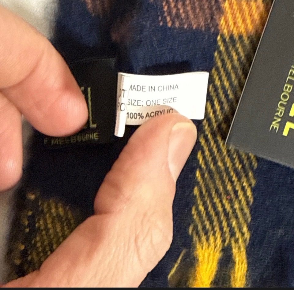 New West Coast Eagles AFL scarf by Avenel, featuring a retro navy, yellow, and brown tartan pattern with fringed ends.