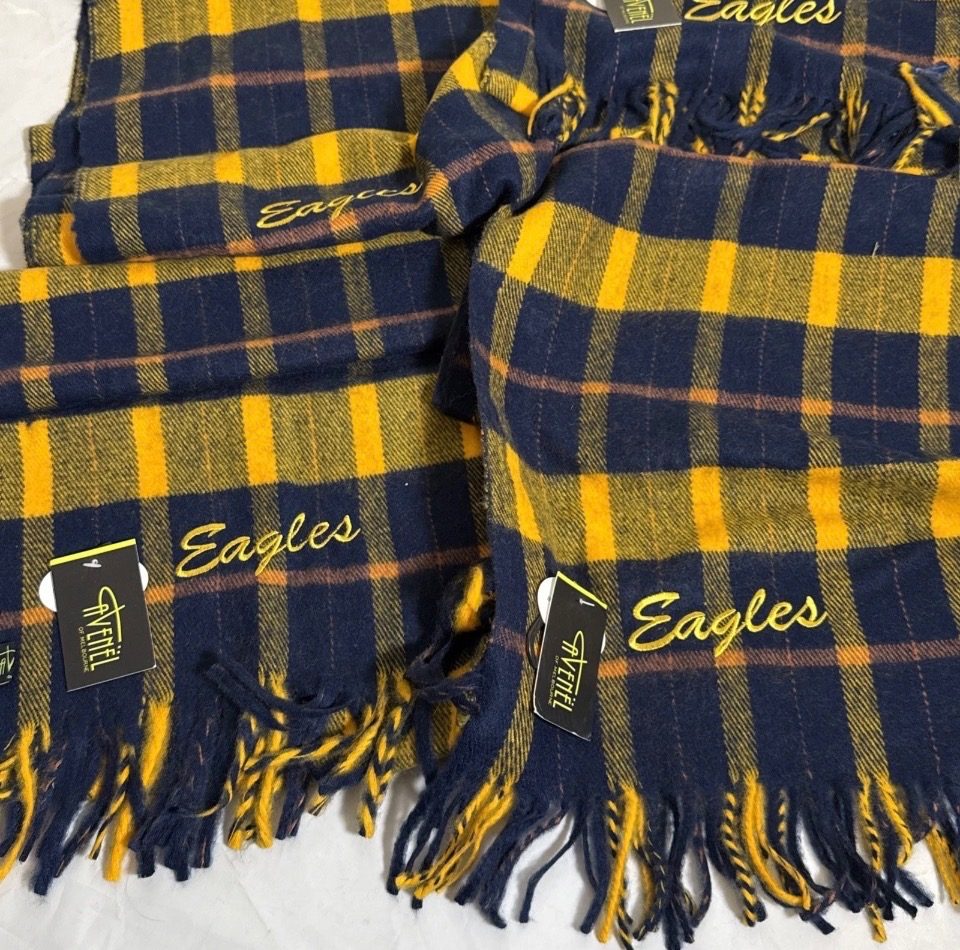 New West Coast Eagles AFL scarf by Avenel, featuring a retro navy, yellow, and brown tartan pattern with fringed ends.