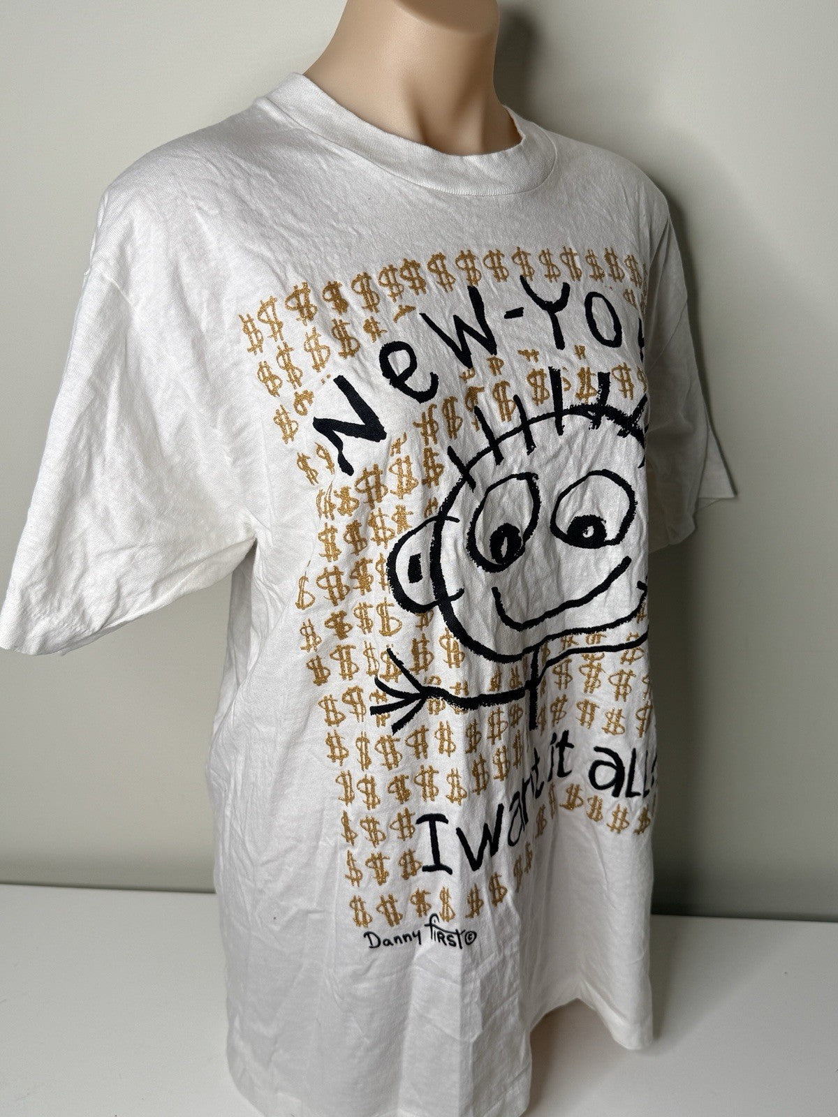 White vintage New York "I Want It All!" graphic T-shirt by Danny First, size XL, featuring a cartoon design and gold dollar signs.