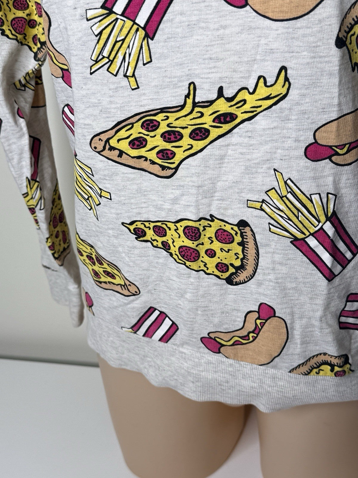 H&M Divided women's XS grey sweatshirt featuring a colorful food print of pizza, hot dogs, and fries.