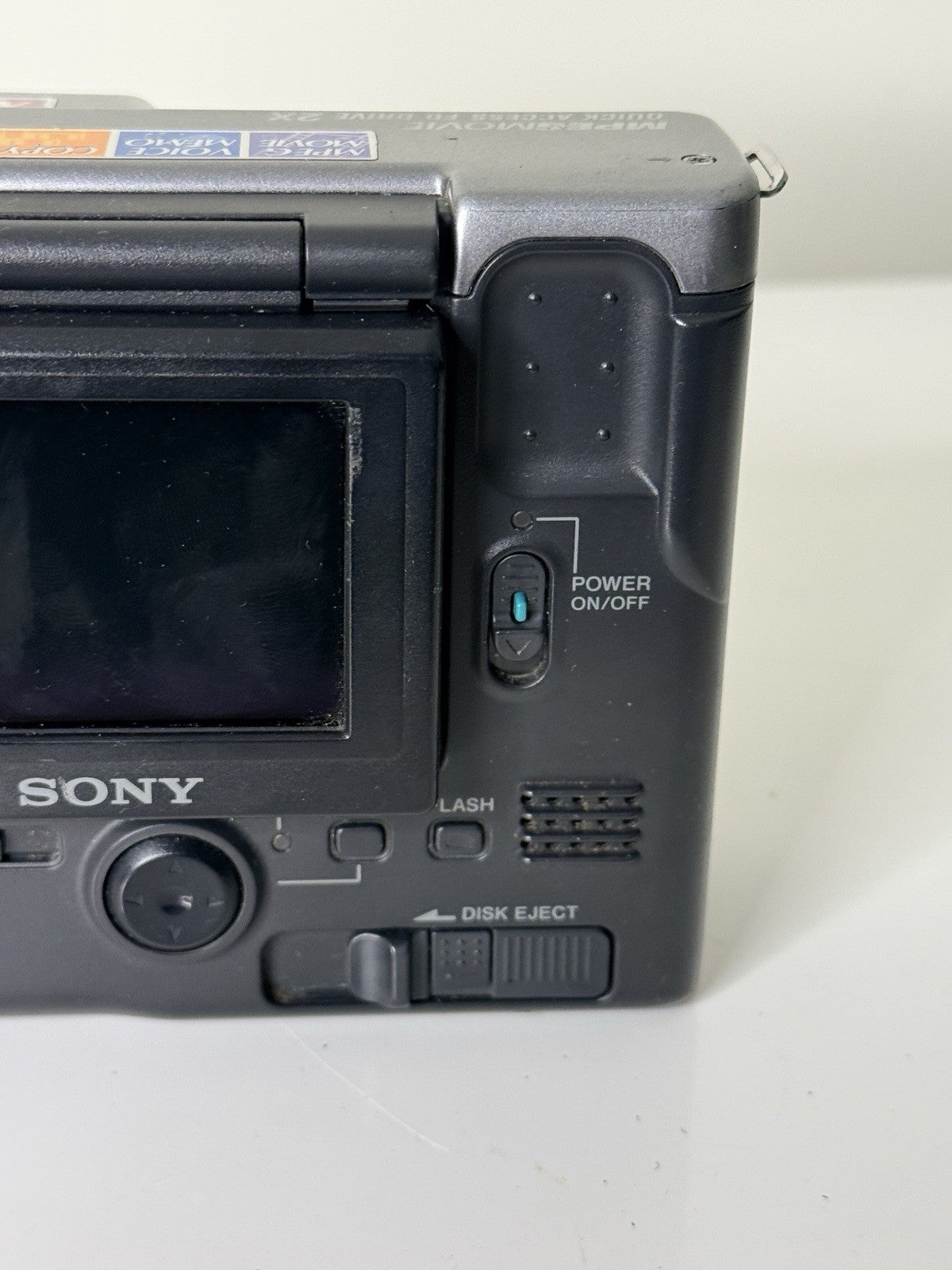 Vintage Sony Digital Mavica MVC-FD91 camera in black and grey, featuring 3.5-inch floppy disk storage.