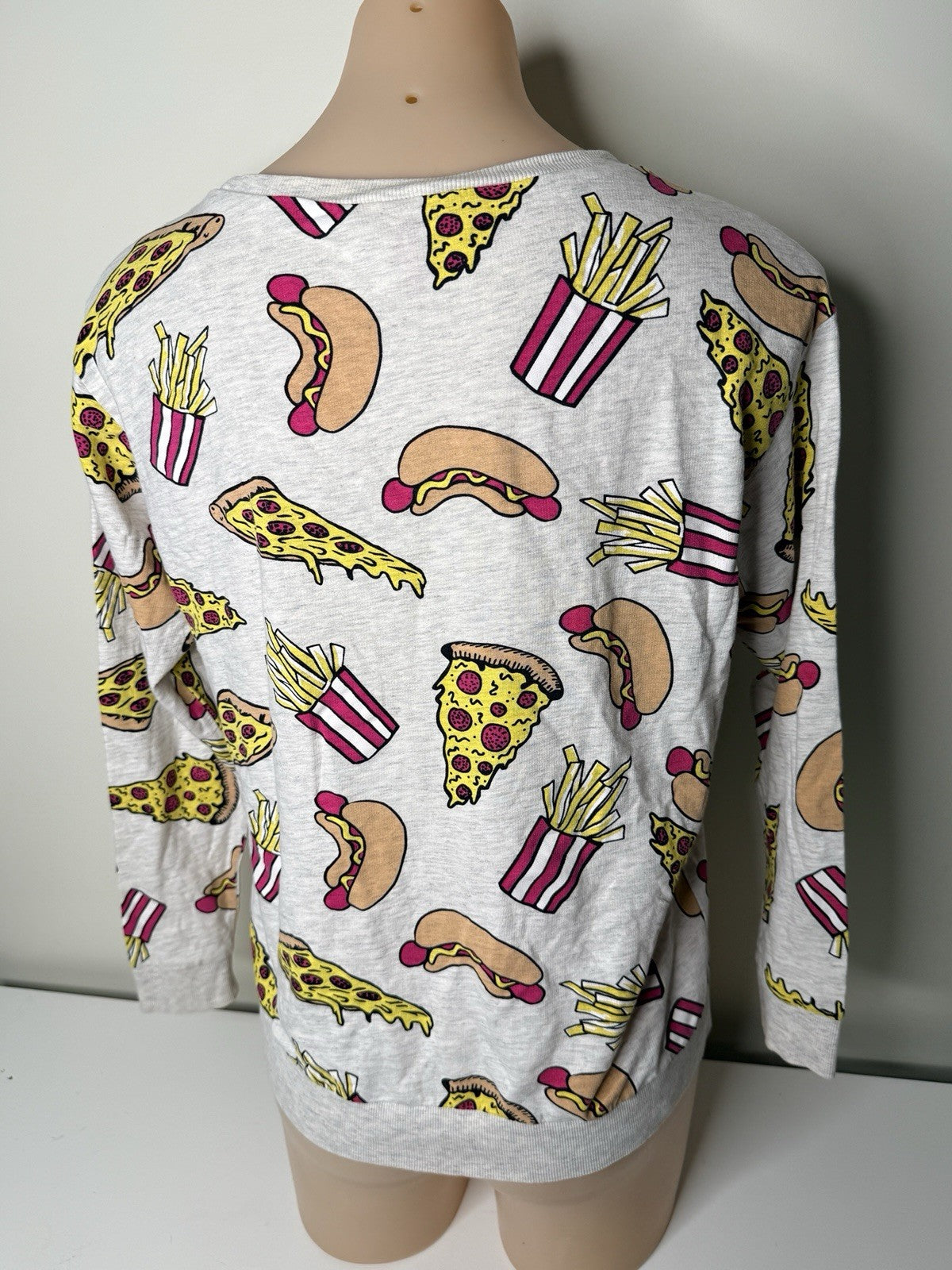 H&M Divided women's XS grey sweatshirt featuring a colorful food print of pizza, hot dogs, and fries.