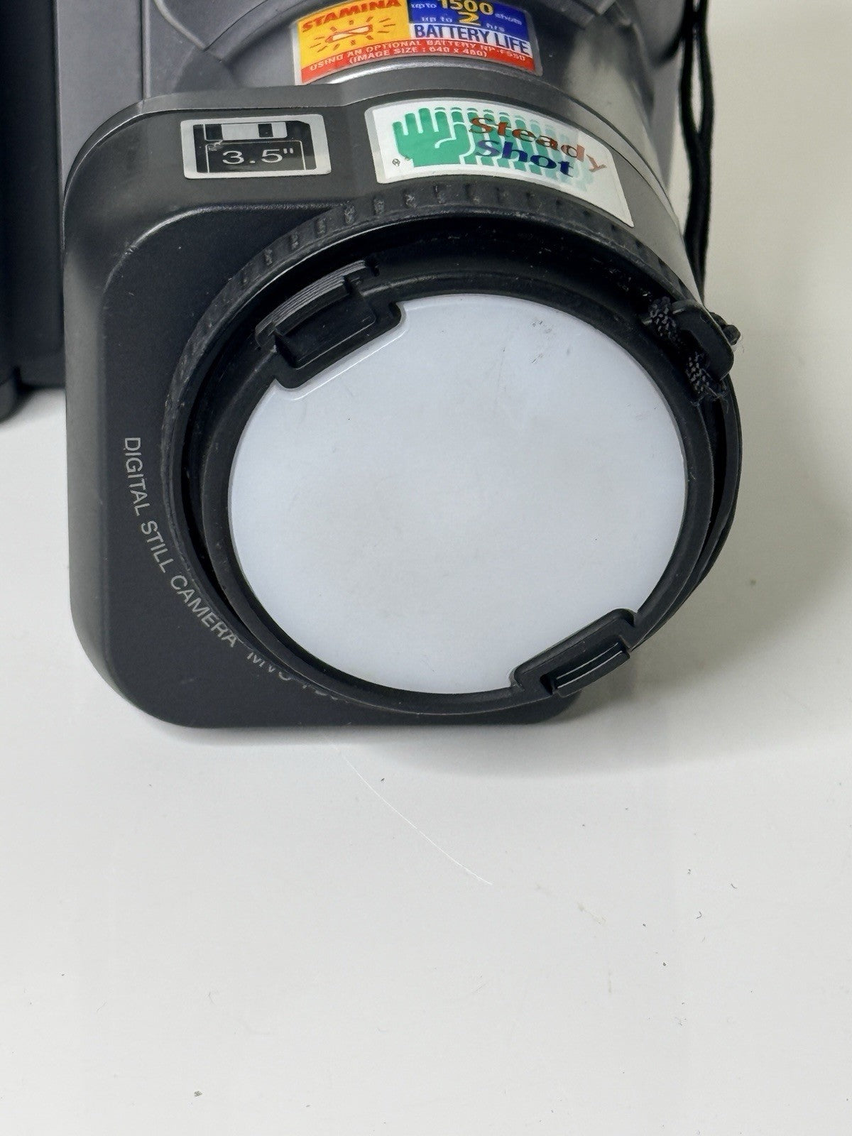 Vintage Sony Digital Mavica MVC-FD91 camera in black and grey, featuring 3.5-inch floppy disk storage.