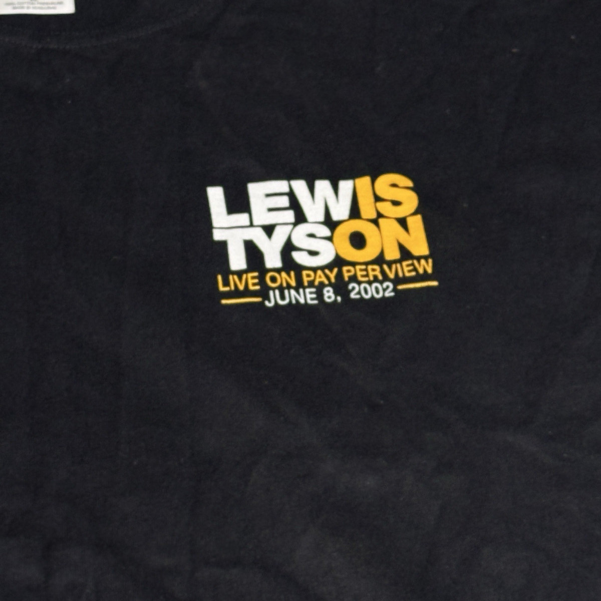 Black, white, and yellow vintage T-shirt featuring Mike Tyson vs. Lennox Lewis, size XL, from 2002.