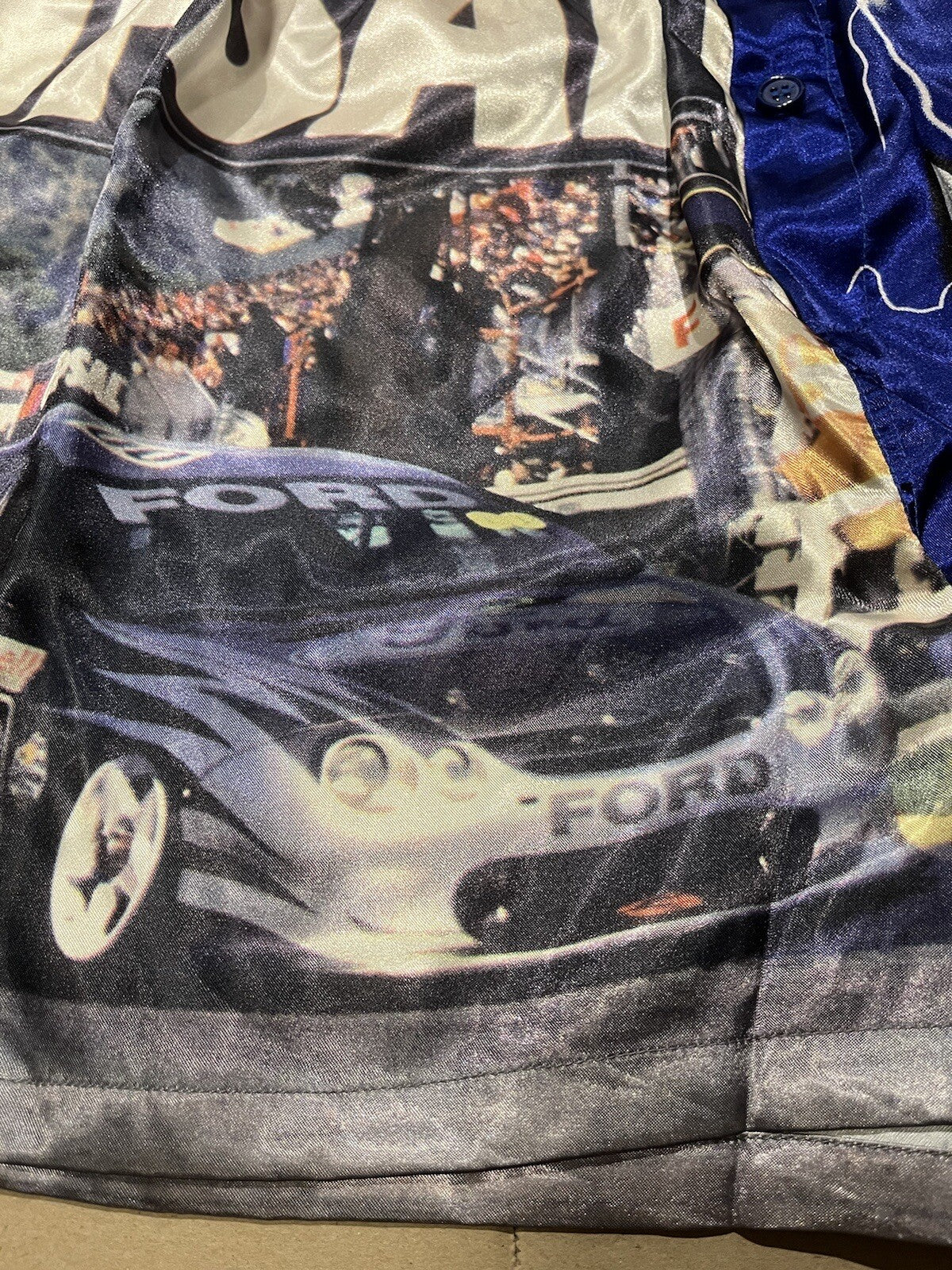 Blue satin boxer shorts featuring Clipsal 500 V8 Supercars print, size M (85–90cm), elasticated waist.