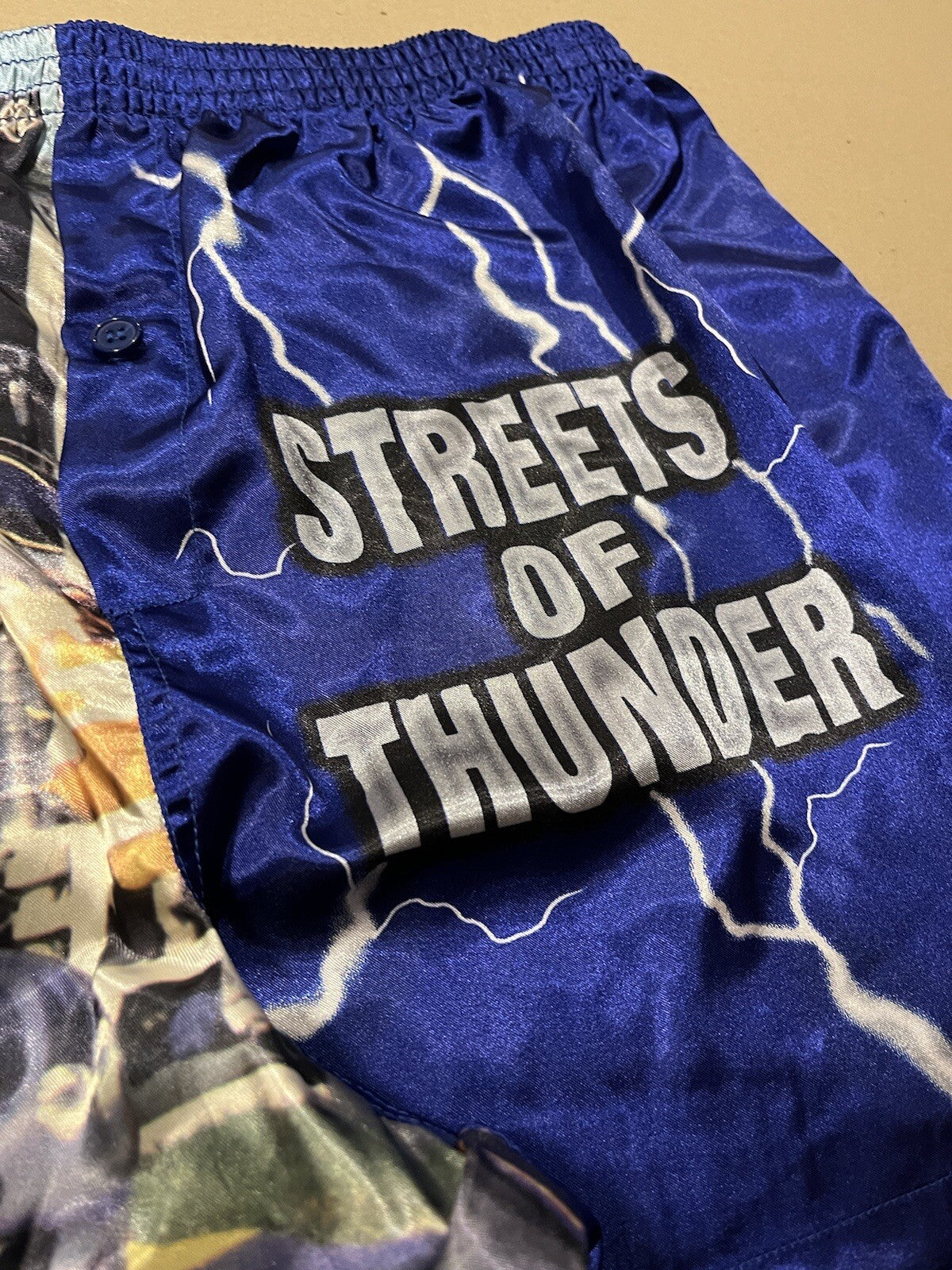 Blue satin boxer shorts featuring Clipsal 500 V8 Supercars print, size S (75–80cm), elasticated waist.