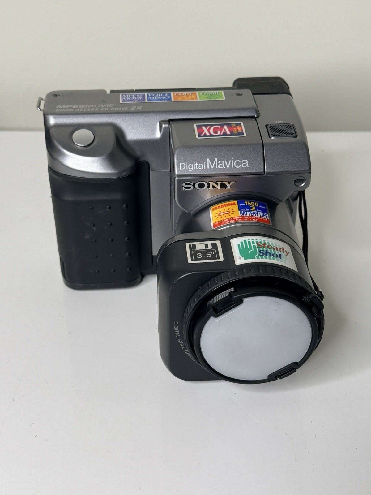 Vintage Sony Digital Mavica MVC-FD91 camera in black and grey, featuring 3.5-inch floppy disk storage.