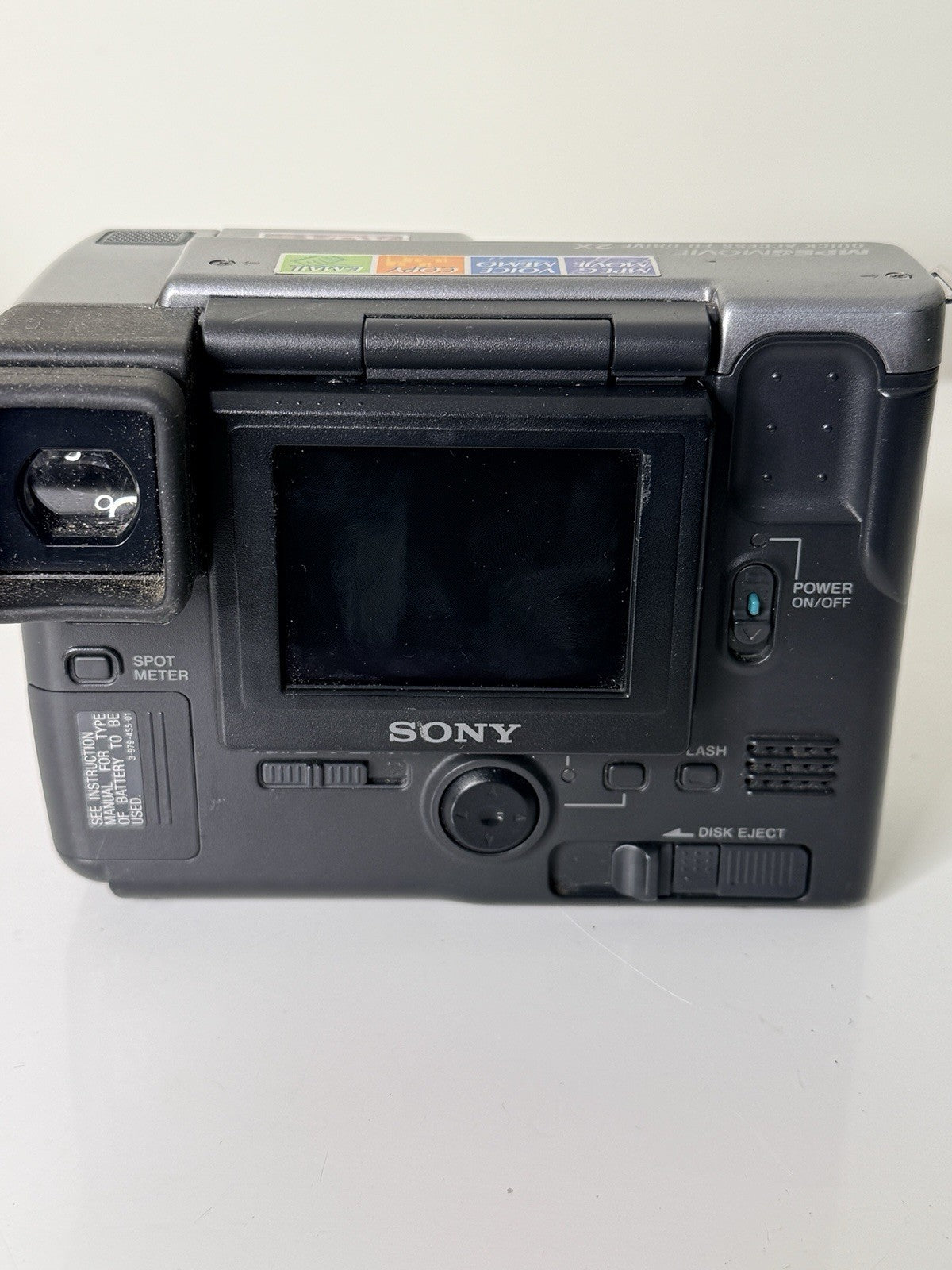 Vintage Sony Digital Mavica MVC-FD91 camera in black and grey, featuring 3.5-inch floppy disk storage.