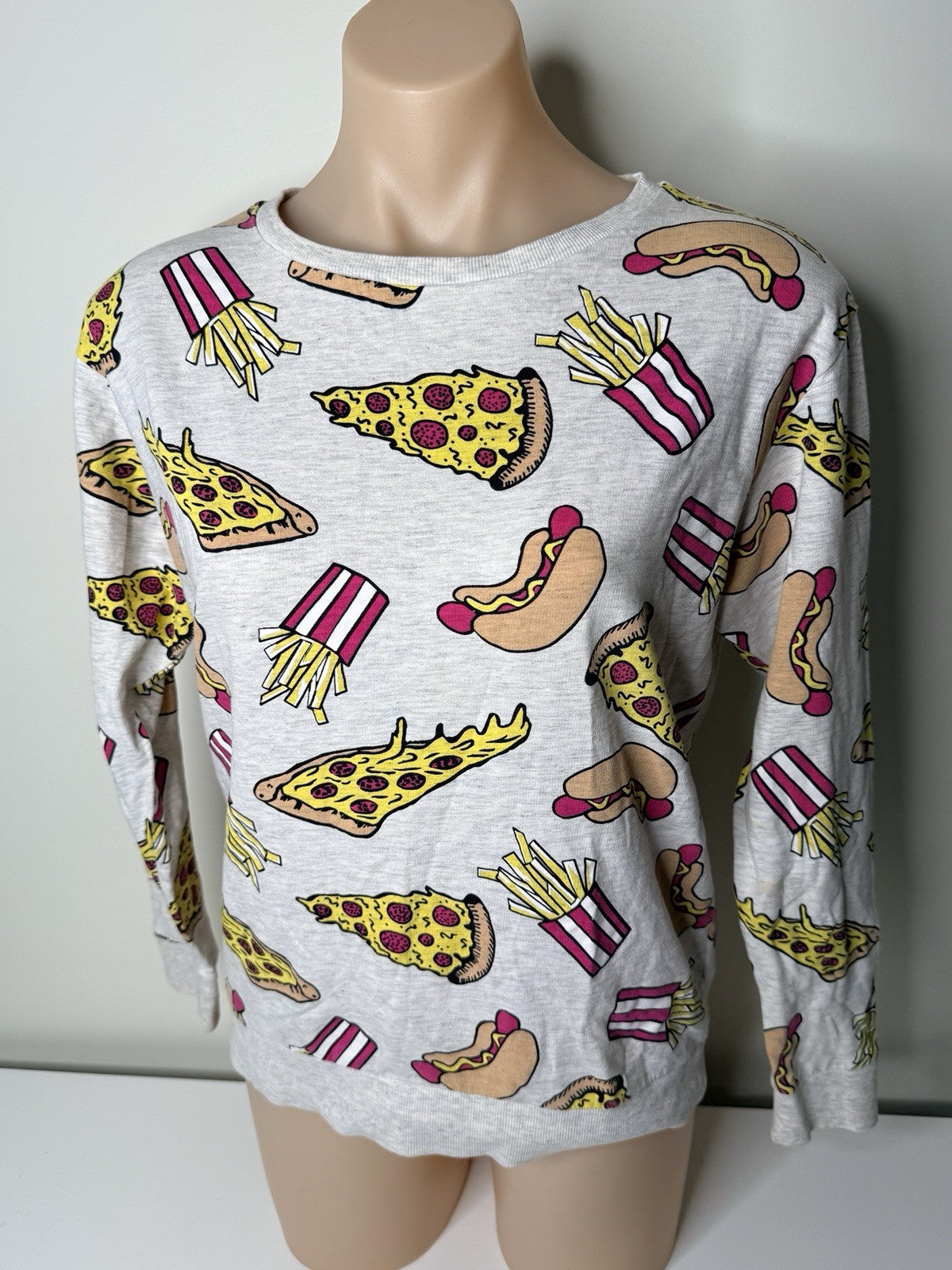 H&M Divided women's XS grey sweatshirt featuring a colorful food print of pizza, hot dogs, and fries.