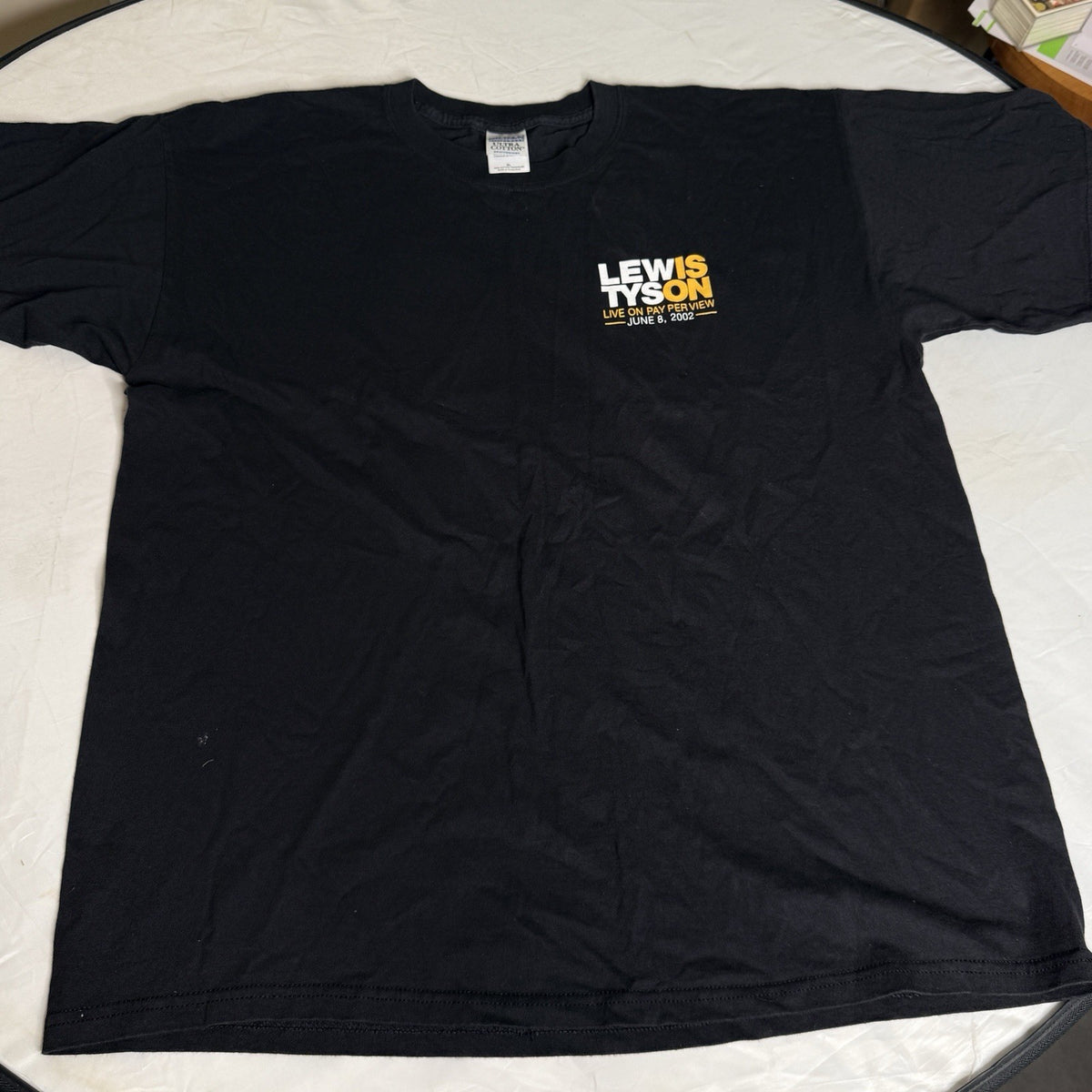 Black, white, and yellow vintage T-shirt featuring Mike Tyson vs. Lennox Lewis, size XL, from 2002.