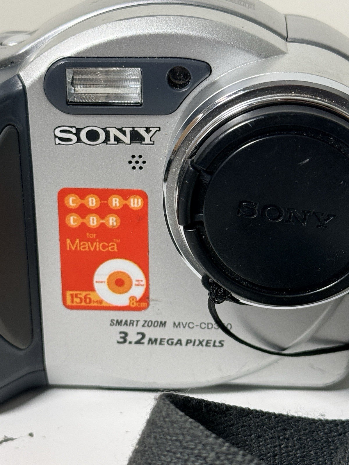 Vintage Sony Mavica MVC-CD350 digital camera in grey and silver, 3.2MP, includes strap and lens cap.