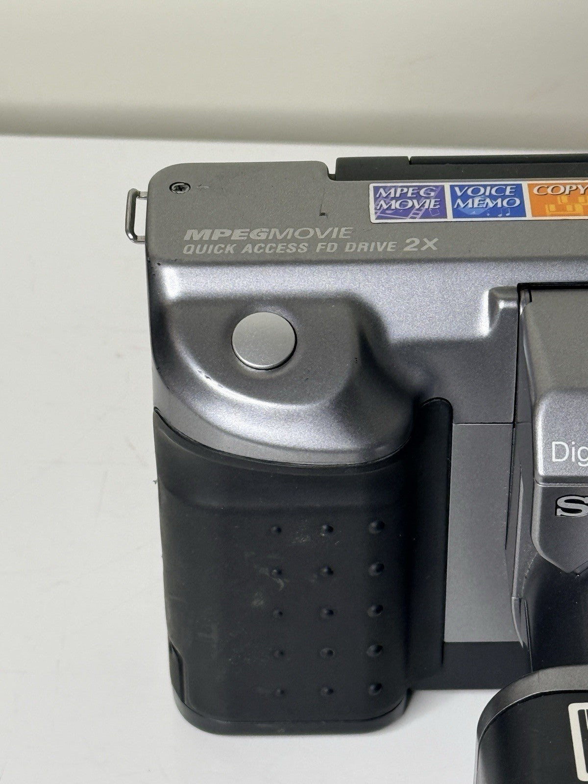Vintage Sony Digital Mavica MVC-FD91 camera in black and grey, featuring 3.5-inch floppy disk storage.