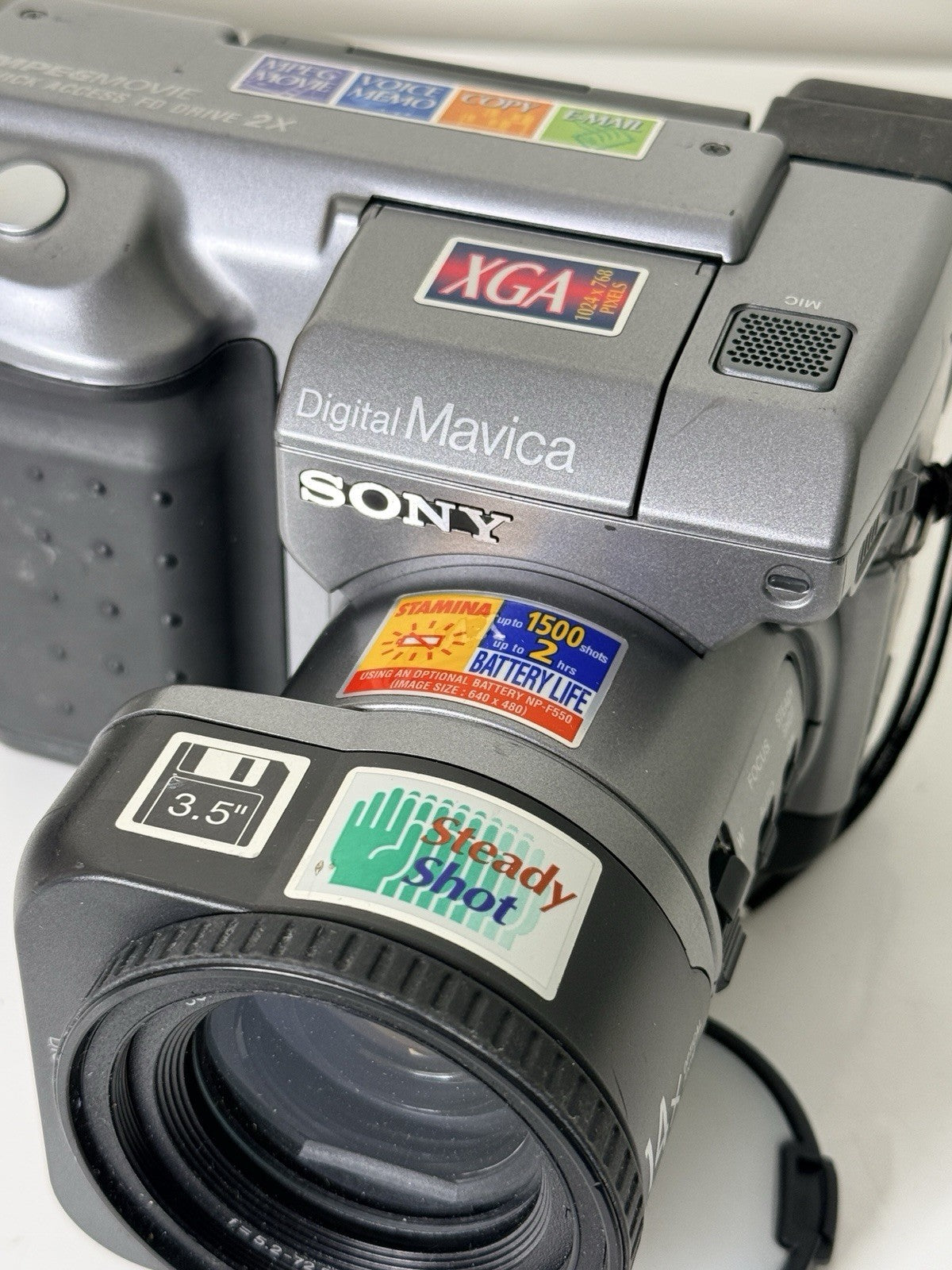 Vintage Sony Digital Mavica MVC-FD91 camera in black and grey, featuring 3.5-inch floppy disk storage.