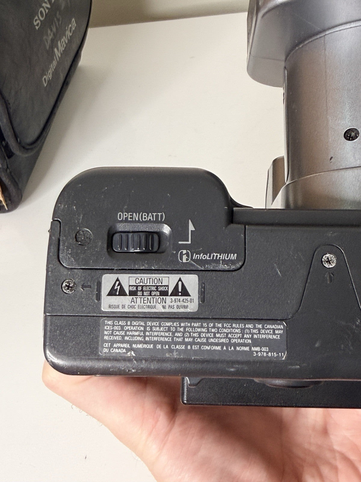 Vintage Sony Digital Mavica MVC-FD91 camera in black and grey, featuring 3.5-inch floppy disk storage.