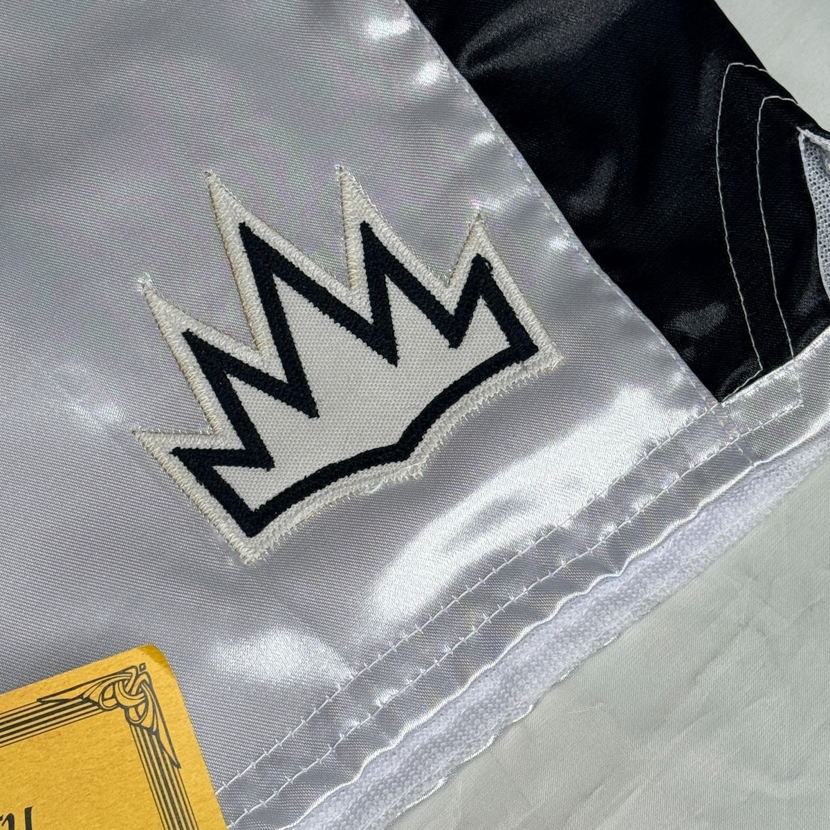 Black and silver boxing shorts signed by Ryan Garcia, featuring the word 'king' and a Certificate of Authenticity.