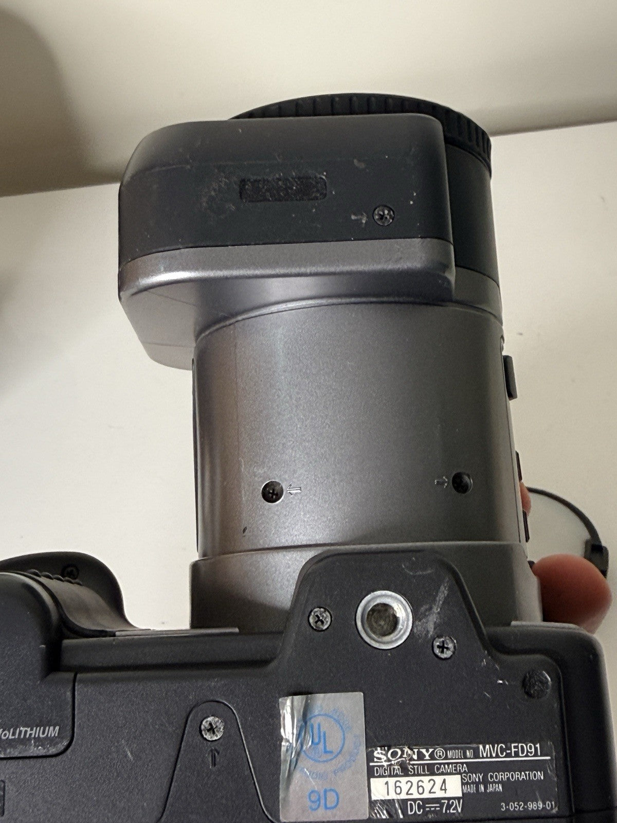 Vintage Sony Digital Mavica MVC-FD91 camera in black and grey, featuring 3.5-inch floppy disk storage.