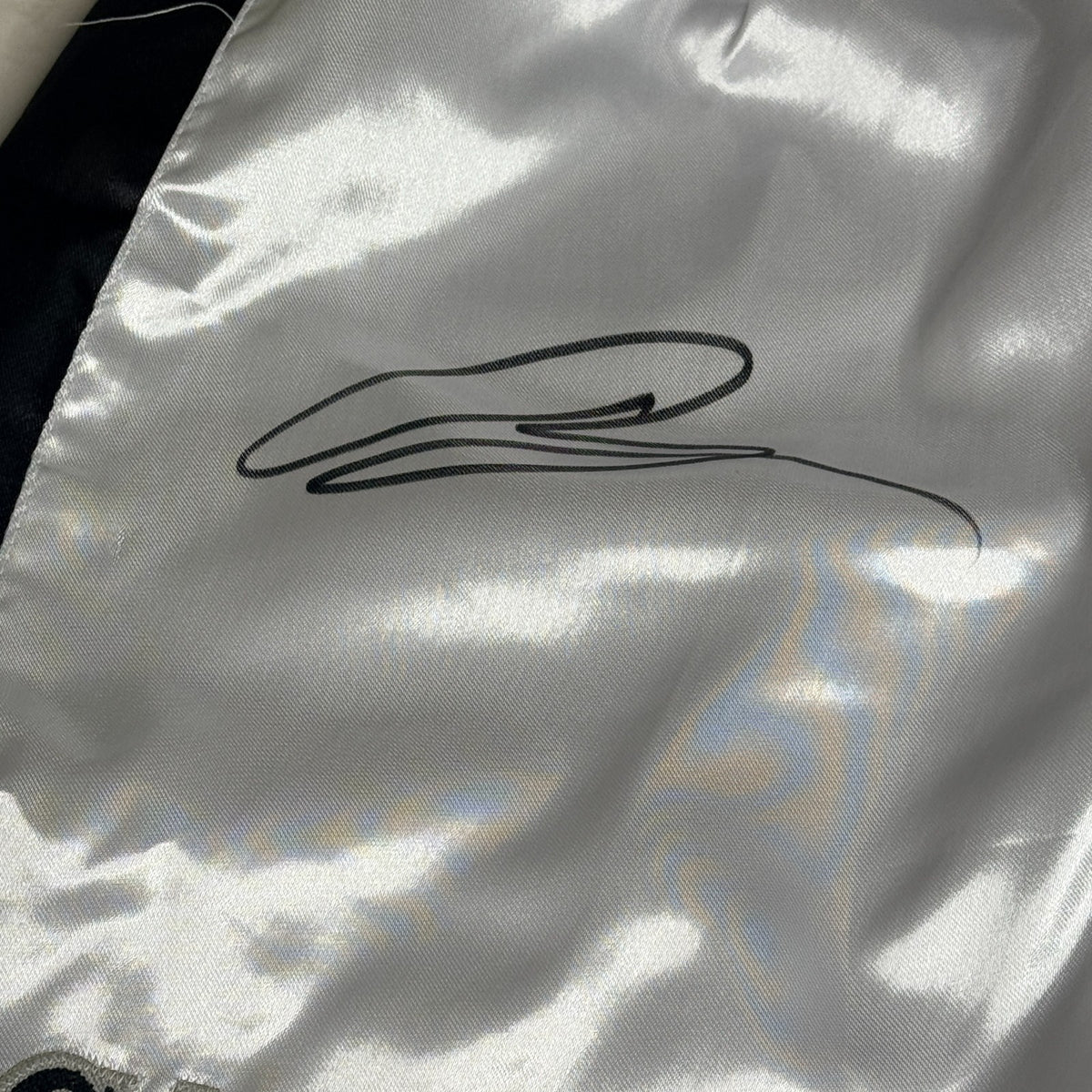 Black and silver boxing shorts signed by Ryan Garcia, featuring the word 'king' and a Certificate of Authenticity.