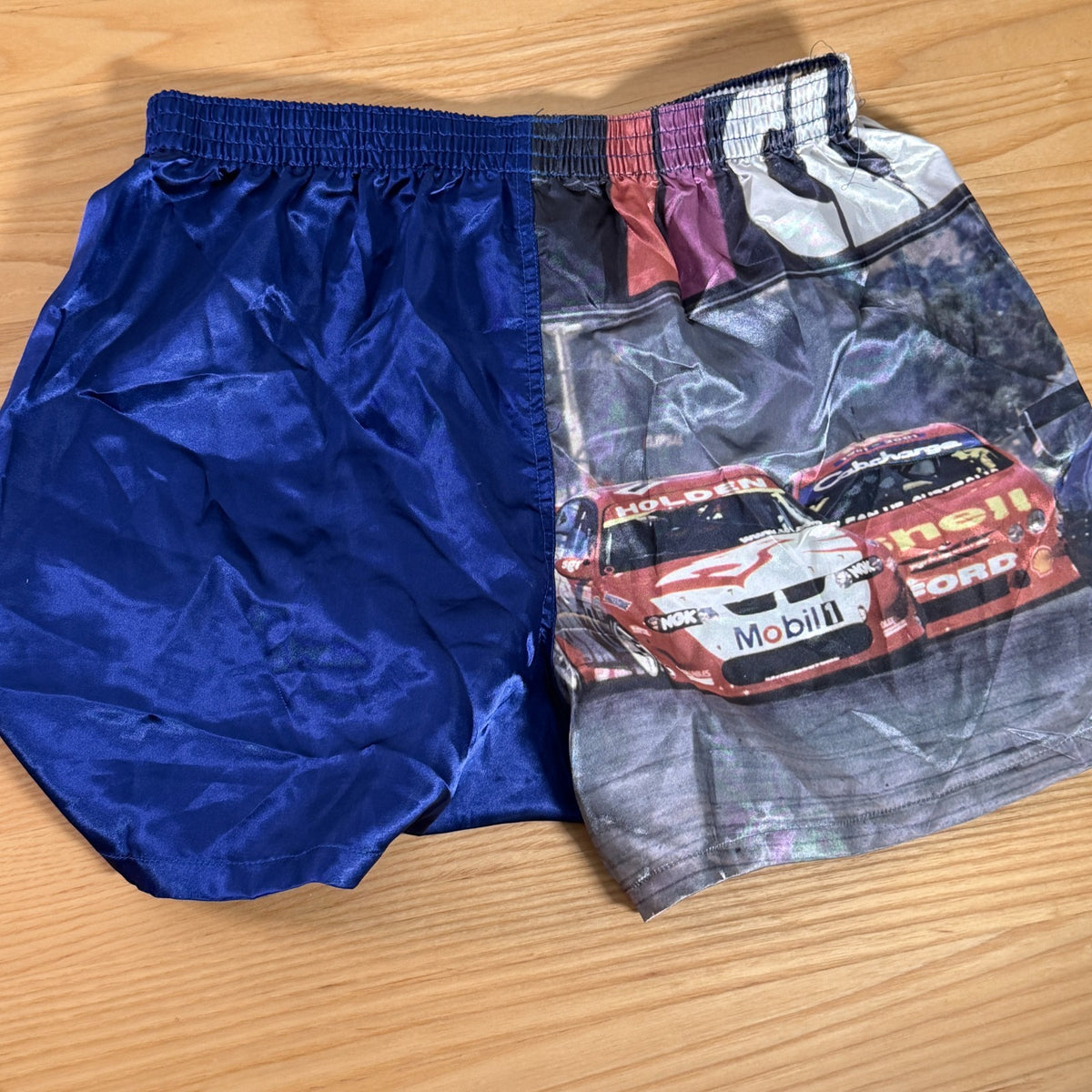 Blue satin boxer shorts featuring Clipsal 500 V8 Supercars print, size S (75–80cm), elasticated waist.